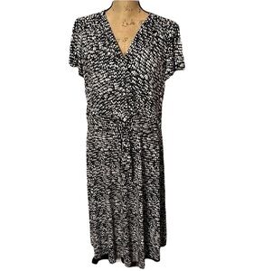 Black and white polka dot CJ Banks faux wrap dress, lined with front tie. NWT.